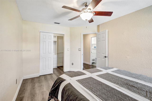 15852 SW 14th St, Pembroke Pines, FL 33027 - bedroom with wood finished floors, a ceiling fan, and a closet