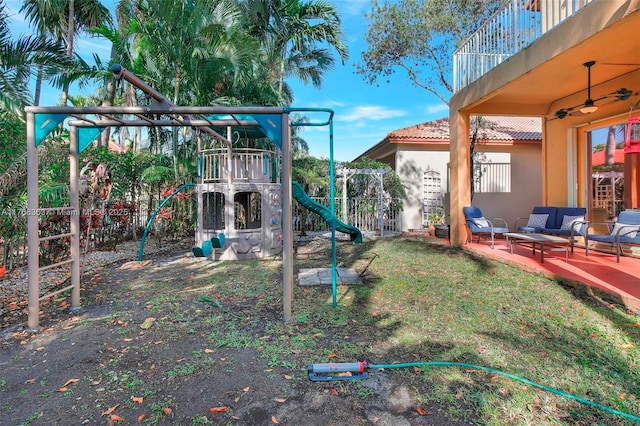 15852 SW 14th St, Pembroke Pines, FL 33027 - view of yard with a playground, a ceiling fan, an outdoor hangout area, and a balcony