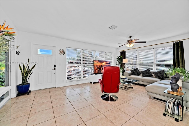 3449 NE 17th Way, Oakland Park, FL 33334 - living area featuring light tile patterned floors and ceiling fan