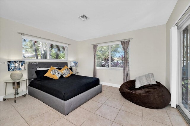 3449 NE 17th Way, Oakland Park, FL 33334 - tiled bedroom with baseboards