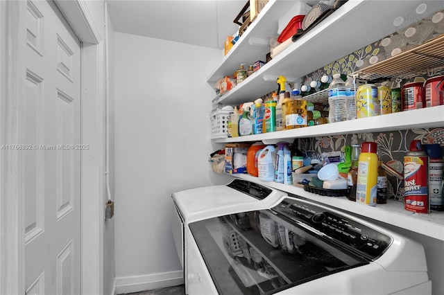 storage area featuring washer and dryer