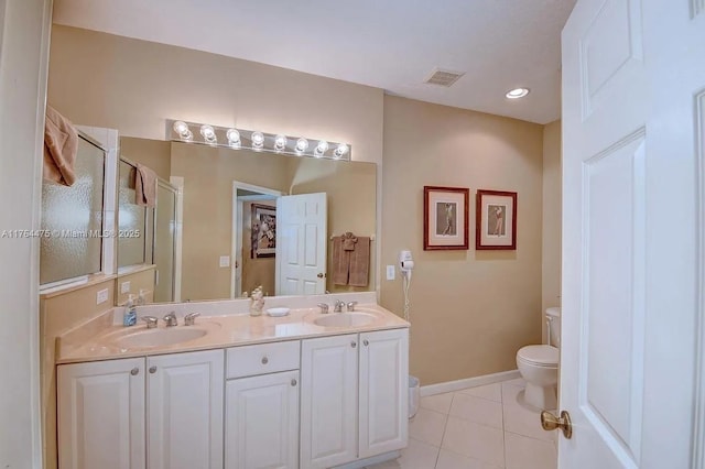 8910 Sandshot Ct Unit 5123, Port St Lucie, FL 34986 - bathroom featuring tile patterned floors, a stall shower, toilet, double vanity, and baseboards