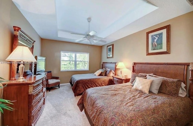 8910 Sandshot Ct Unit 5123, Port St Lucie, FL 34986 - bedroom with a raised ceiling, light colored carpet, baseboards, and ceiling fan