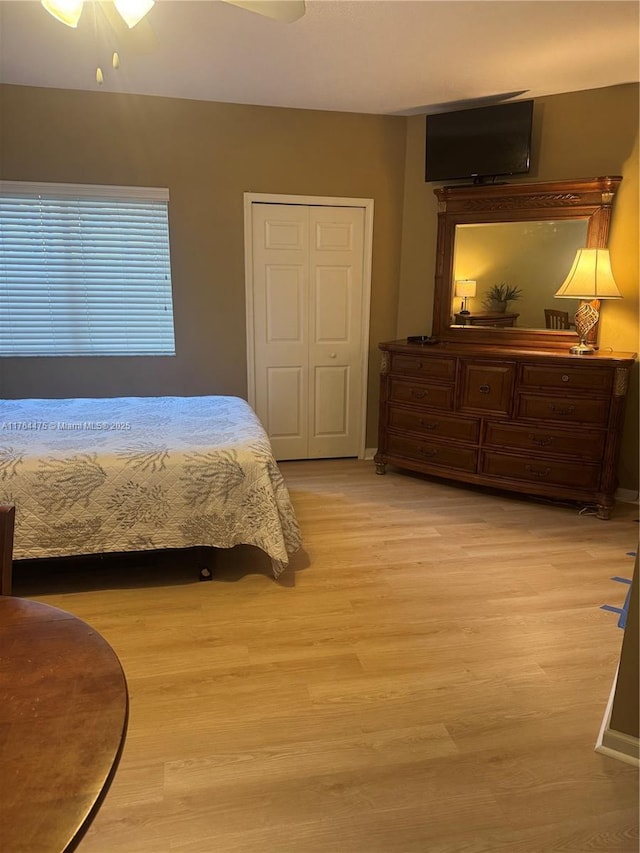 8910 Sandshot Ct Unit 5123, Port St Lucie, FL 34986 - bedroom with light wood finished floors, ceiling fan, and baseboards