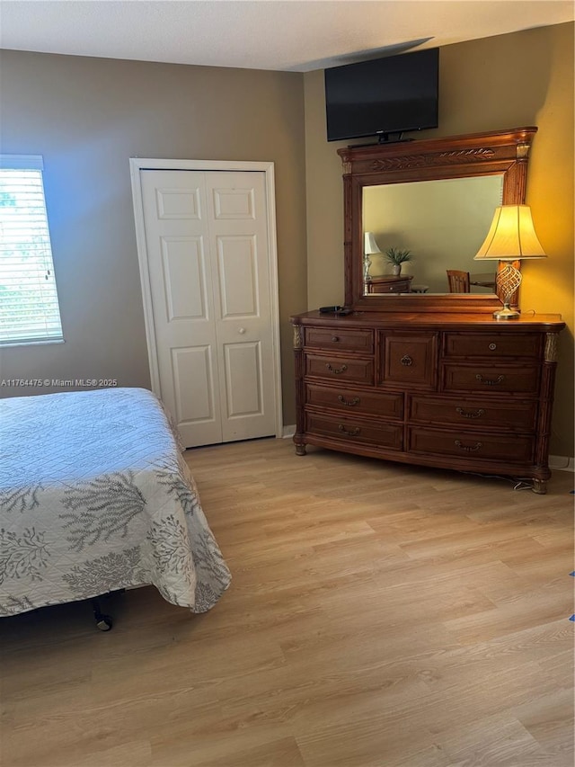 8910 Sandshot Ct Unit 5123, Port St Lucie, FL 34986 - bedroom featuring light wood-type flooring and baseboards