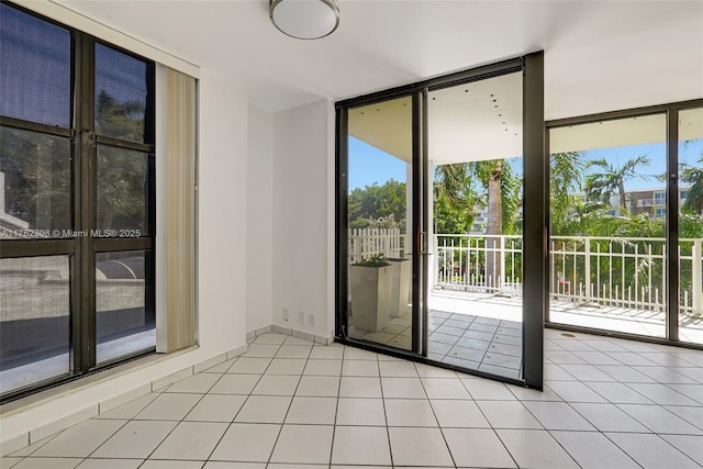 4000 Towerside Ter Unit 302, Miami, FL 33138 - unfurnished room featuring floor to ceiling windows and light tile patterned flooring