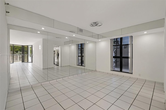 4000 Towerside Ter Unit 302, Miami, FL 33138 - unfurnished room with light tile patterned floors and recessed lighting