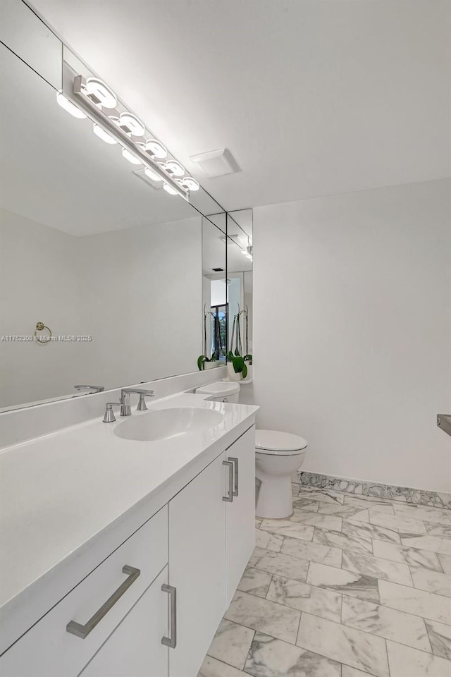 4000 Towerside Ter Unit 302, Miami, FL 33138 - bathroom featuring vanity, marble finish floors, toilet, and baseboards