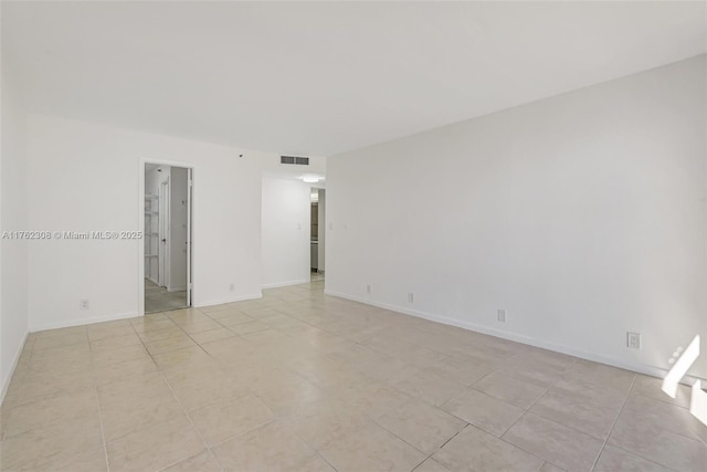 4000 Towerside Ter Unit 302, Miami, FL 33138 - unfurnished room featuring light tile patterned floors and baseboards