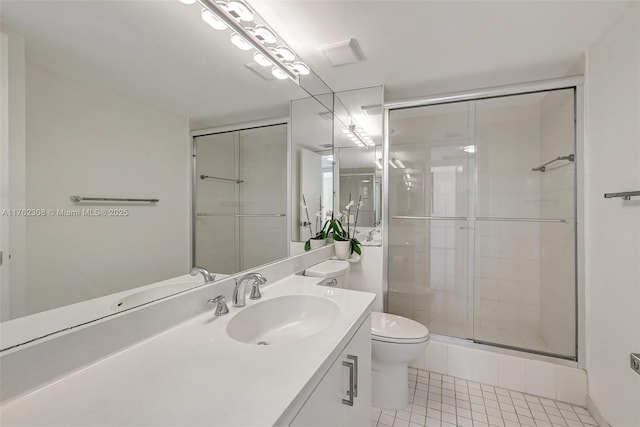 4000 Towerside Ter Unit 302, Miami, FL 33138 - bathroom with tile patterned flooring, a shower stall, vanity, and toilet