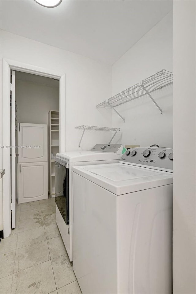 4000 Towerside Ter Unit 302, Miami, FL 33138 - laundry area featuring washing machine and clothes dryer