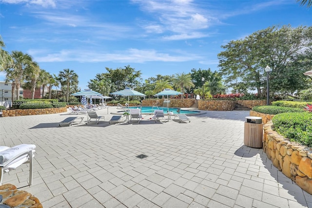 4000 Towerside Ter Unit 302, Miami, FL 33138 - view of home's community featuring a patio area and a pool