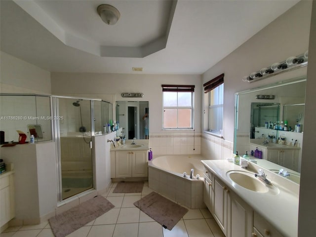 11009 NW 80th Ln, Doral, FL 33178 - bathroom featuring a shower stall, a garden tub, two vanities, tile patterned floors, and a raised ceiling