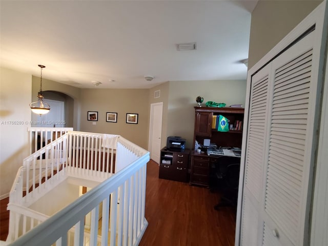 11009 NW 80th Ln, Doral, FL 33178 - hallway with dark wood-style flooring, an upstairs landing, a desk, and arched walkways