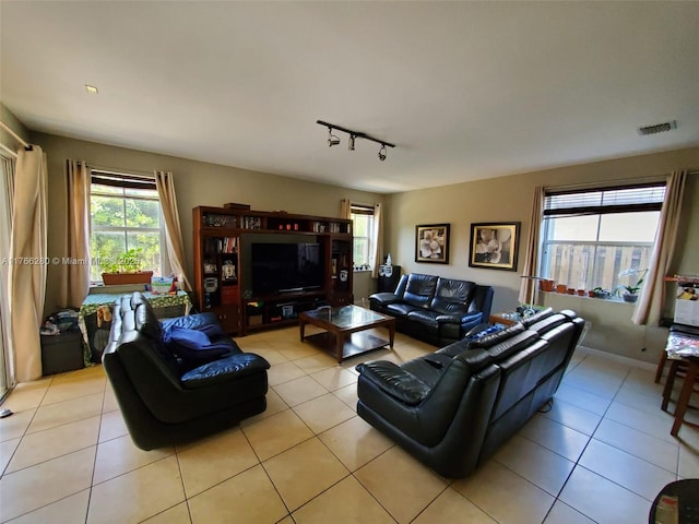 11009 NW 80th Ln, Doral, FL 33178 - living room featuring light tile patterned floors and rail lighting