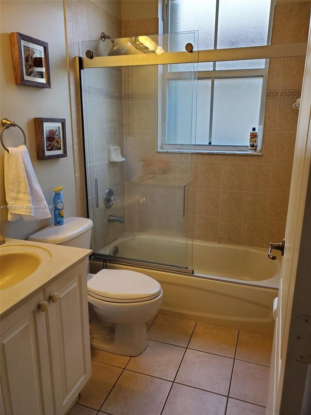 11009 NW 80th Ln, Doral, FL 33178 - bathroom featuring vanity, enclosed tub / shower combo, and tile patterned flooring