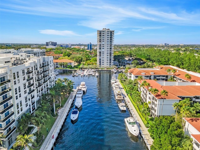 birds eye view of property featuring a view of city and a water view