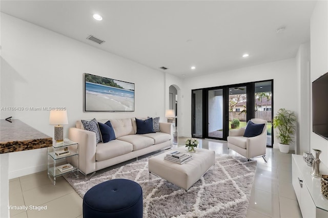 14555 SW 32nd St, Miami, FL 33175 - living area with recessed lighting, arched walkways, light tile patterned floors, and visible vents