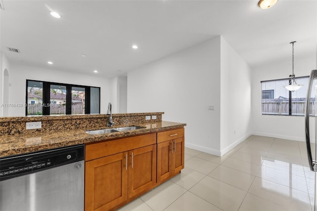 14555 SW 32nd St, Miami, FL 33175 - kitchen featuring recessed lighting, dark stone countertops, dishwasher, a sink, and brown cabinets