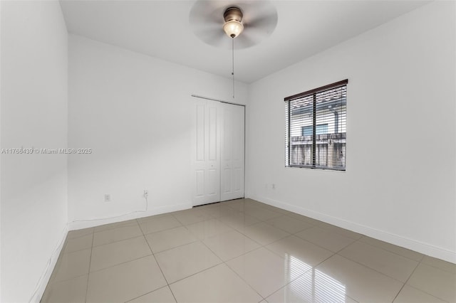 14555 SW 32nd St, Miami, FL 33175 - empty room featuring light tile patterned floors, baseboards, and ceiling fan