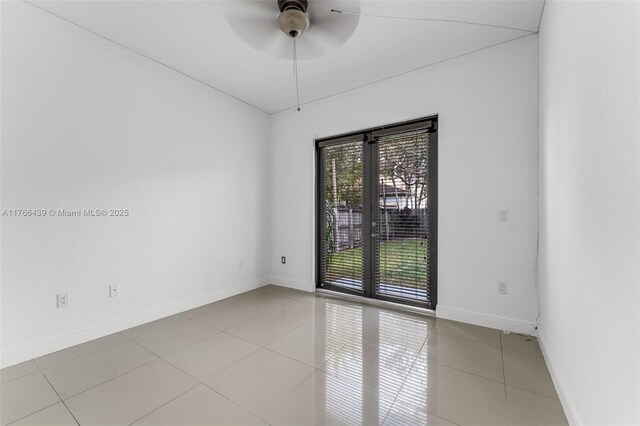 14555 SW 32nd St, Miami, FL 33175 - spare room featuring french doors, light tile patterned floors, ceiling fan, and baseboards