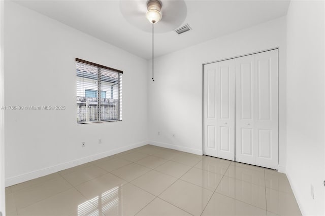 14555 SW 32nd St, Miami, FL 33175 - unfurnished bedroom featuring visible vents, baseboards, a closet, ceiling fan, and light tile patterned flooring