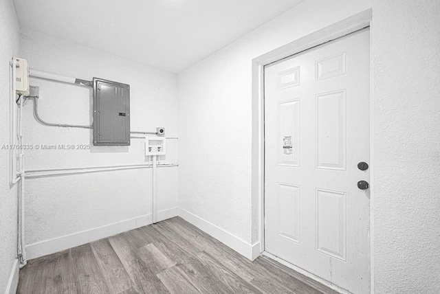 400 NW 117th St, Miami, FL 33168 - interior space featuring electric panel, baseboards, and wood finished floors