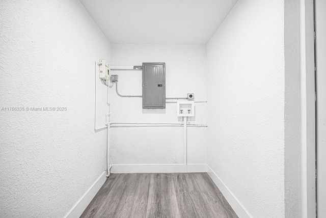 400 NW 117th St, Miami, FL 33168 - interior space with electric panel, baseboards, and wood finished floors