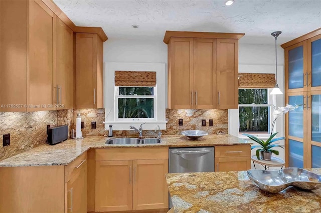 kitchen with light tile patterned floors, stainless steel appliances, and light stone countertops