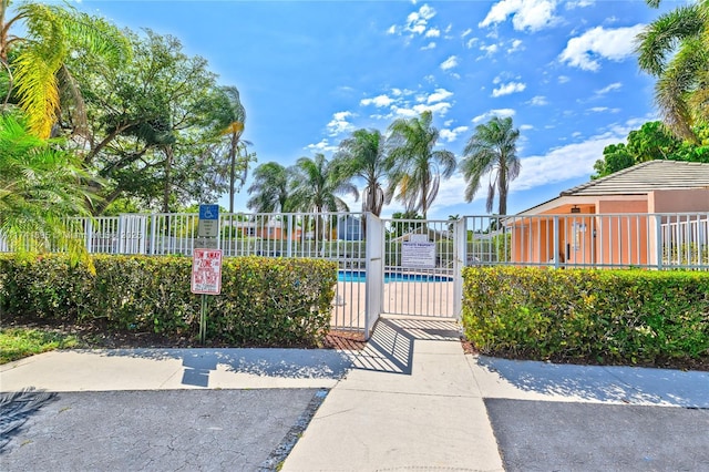 view of gate featuring fence