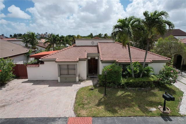 8918 SW 5th Ter, Miami, FL 33174 - mediterranean / spanish home featuring fence, stucco siding, a tile roof, a front lawn, and driveway