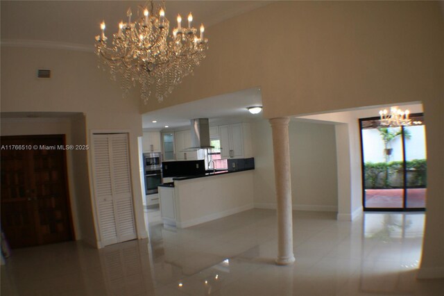 8918 SW 5th Ter, Miami, FL 33174 - interior space with visible vents, stainless steel appliances, white cabinetry, island range hood, and a notable chandelier