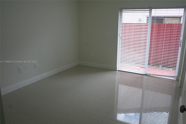 8918 SW 5th Ter, Miami, FL 33174 - tiled spare room with baseboards and a wealth of natural light