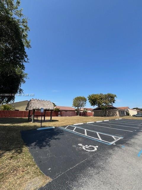 8918 SW 5th Ter, Miami, FL 33174 - uncovered parking lot featuring fence