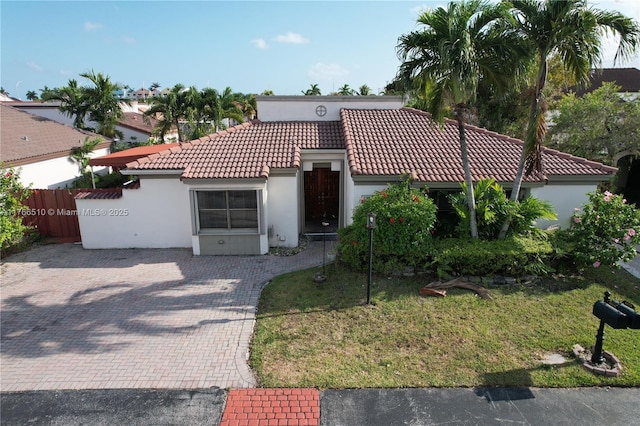 8918 SW 5th Ter, Miami, FL 33174 - mediterranean / spanish home with a tile roof, a front yard, fence, and stucco siding