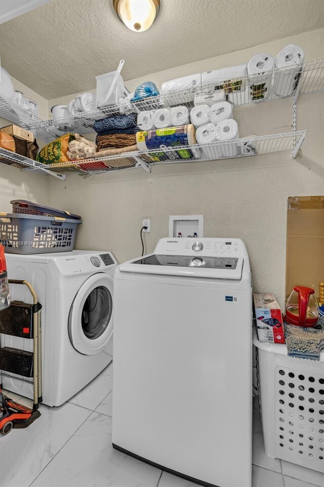 1522 NE 148th St, Miami, FL 33161 - laundry area with laundry area, marble finish floor, and washer and dryer