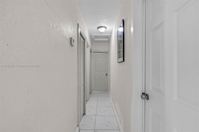 1522 NE 148th St, Miami, FL 33161 - hallway featuring baseboards and marble finish floor