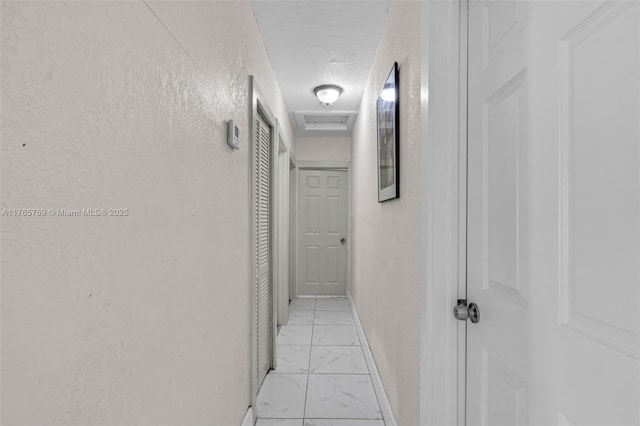 1522 NE 148th St, Miami, FL 33161 - hall featuring light marble finish floors and a textured ceiling