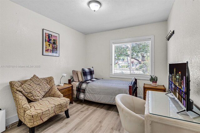 1522 NE 148th St, Miami, FL 33161 - bedroom with a textured wall and wood finished floors