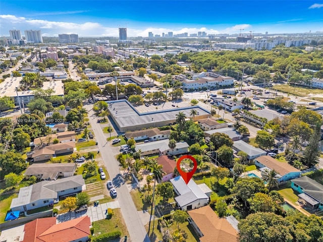 birds eye view of property with a view of city