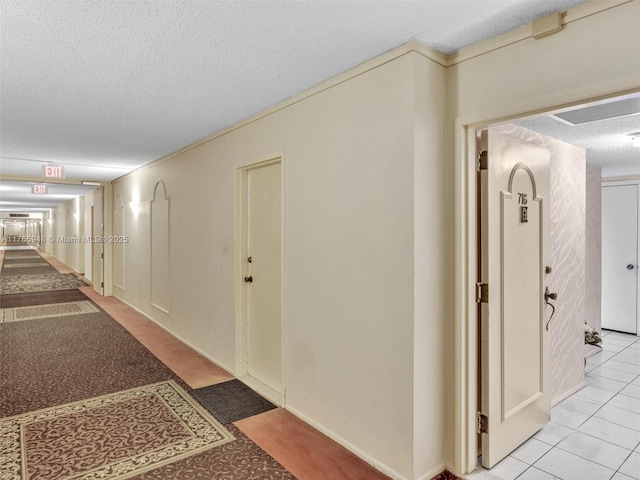 800 NE 195th St Unit 716, Miami, FL 33179 - hall with tile patterned flooring and a textured ceiling