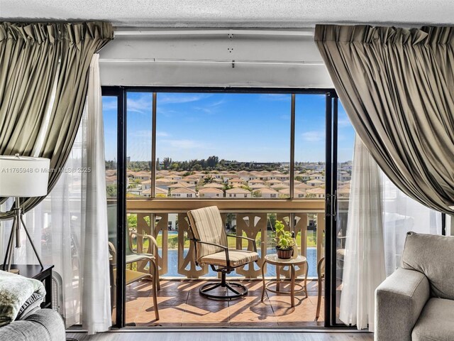 800 NE 195th St Unit 716, Miami, FL 33179 - interior space with floor to ceiling windows and a textured ceiling