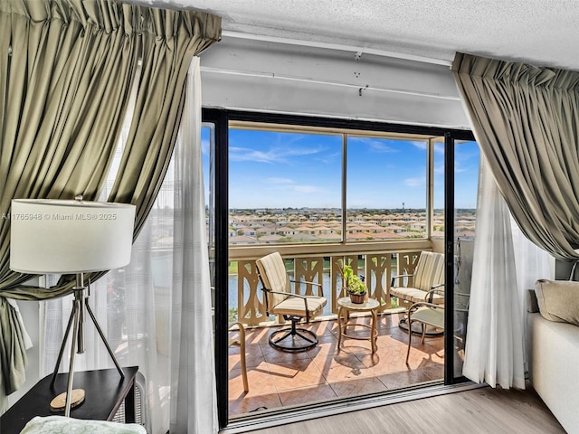 800 NE 195th St Unit 716, Miami, FL 33179 - interior space featuring wood finished floors and a textured ceiling