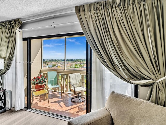 800 NE 195th St Unit 716, Miami, FL 33179 - interior space featuring a textured ceiling and wood finished floors