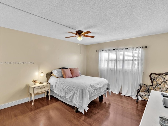 800 NE 195th St Unit 716, Miami, FL 33179 - bedroom with baseboards, a textured ceiling, a ceiling fan, and wood finished floors