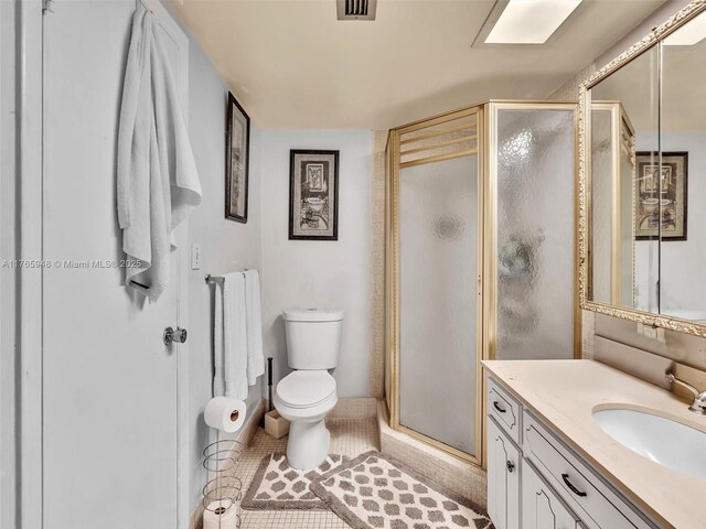 800 NE 195th St Unit 716, Miami, FL 33179 - bathroom featuring tile patterned flooring, visible vents, toilet, a stall shower, and vanity