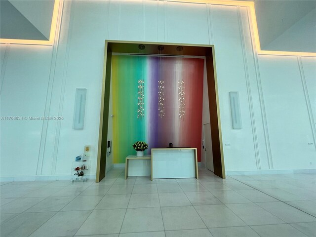 700 NE 26th Ter Unit 2205, Miami, FL 33137 - interior space with light tile patterned floors and a decorative wall