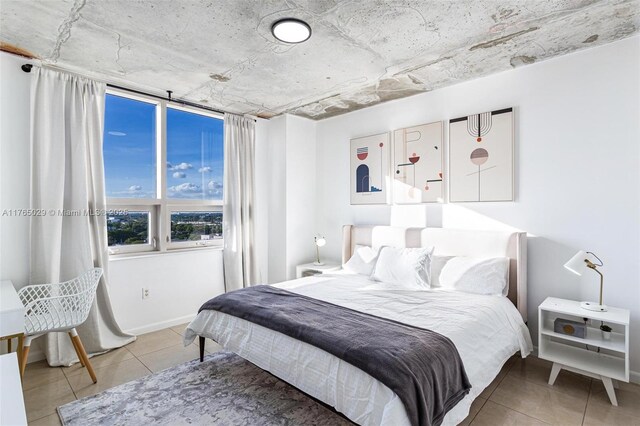 tiled bedroom with baseboards