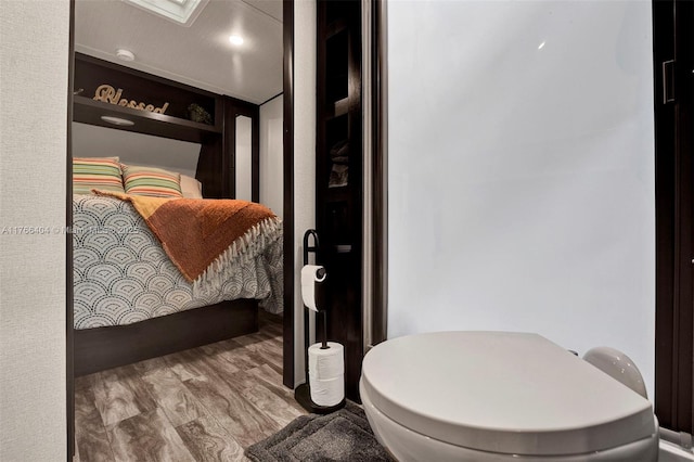 bedroom with wood finished floors