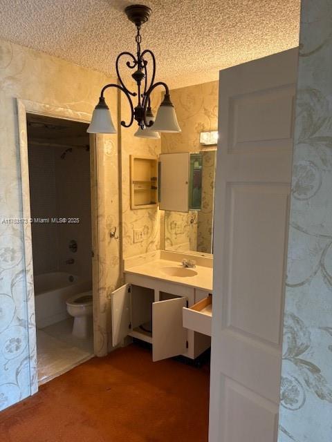 3701 N Country Club Dr Unit 207, Aventura, FL 33180 - full bath featuring vanity, a textured ceiling, a chandelier, and toilet